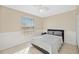 Neutral bedroom with a ceiling fan, good natural light, and updated flooring at 1817 New London St, North Port, FL 34288