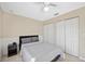 Bedroom with a ceiling fan, natural light, and double door closet at 1817 New London St, North Port, FL 34288