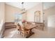 Dining room features beautiful natural light, tile flooring, and stylish wood accent wall at 1817 New London St, North Port, FL 34288