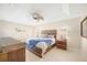 Serene main bedroom featuring a tray ceiling, ceiling fan, and neutral decor at 1817 New London St, North Port, FL 34288