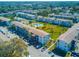 Aerial view of community, showcasing buildings, pool, and landscaping at 1853 Restful Dr # L2, Bradenton, FL 34207