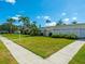 Building exterior showcasing landscaping and walkway at 1853 Restful Dr # L2, Bradenton, FL 34207