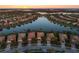 Aerial view of a waterfront community with several homes at 19256 Jalisca St, Venice, FL 34293