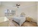 Comfortable bedroom with light walls and a ceiling fan at 19256 Jalisca St, Venice, FL 34293