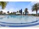 Relaxing resort-style pool with lounge chairs and umbrellas at 19256 Jalisca St, Venice, FL 34293