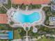 Aerial view of resort-style pool with surrounding lounge chairs at 19256 Jalisca St, Venice, FL 34293