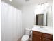 Clean bathroom with a vanity, toilet, and shower at 19261 Isadora St, Venice, FL 34293