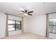 Bedroom with pool view and ceiling fan at 19261 Isadora St, Venice, FL 34293