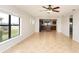 Spacious living room with tile floors and open kitchen view at 19261 Isadora St, Venice, FL 34293