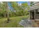 Small backyard with patio furniture and trees at 2047 Canal Dr # L6, Bradenton, FL 34207