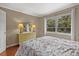 Bedroom with wood floors, window, and dresser at 2047 Canal Dr # L6, Bradenton, FL 34207