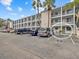 Condo building exterior, showing unit entrance and parking at 2047 Canal Dr # L6, Bradenton, FL 34207