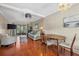 Living room with hardwood floors, wicker furniture, and sliding glass door at 2047 Canal Dr # L6, Bradenton, FL 34207