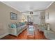 Living room with hardwood floors, wicker furniture, and sliding glass door at 2047 Canal Dr # L6, Bradenton, FL 34207