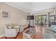 Living room with hardwood floors, wicker furniture, and sliding glass door at 2047 Canal Dr # L6, Bradenton, FL 34207