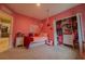 Bedroom with pink walls, closet, and a twin-size bed at 22490 Madelyn Ave, Port Charlotte, FL 33954