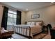 Guest bedroom with a metal bed frame and window at 22490 Madelyn Ave, Port Charlotte, FL 33954