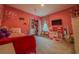 bedroom with pink walls, ample closet space, and play kitchen at 22490 Madelyn Ave, Port Charlotte, FL 33954