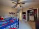 bedroom with Spiderman theme, built-in closet, and TV at 22490 Madelyn Ave, Port Charlotte, FL 33954