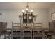 Elegant dining room featuring a rustic table and chandelier at 22490 Madelyn Ave, Port Charlotte, FL 33954