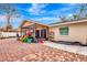 Brick patio with screened porch and colorful chairs at 2341 Spring Oaks Cir, Sarasota, FL 34234