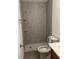 Clean bathroom with a shower and toilet at 2341 Spring Oaks Cir, Sarasota, FL 34234