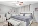 Charming bedroom with king-size bed, white bench, and crib at 2341 Spring Oaks Cir, Sarasota, FL 34234