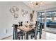 Modern dining room featuring a glass table and black chairs at 2341 Spring Oaks Cir, Sarasota, FL 34234