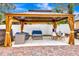 Covered patio with seating area and dining table at 2341 Spring Oaks Cir, Sarasota, FL 34234