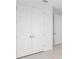 White double-door closet with tile flooring at 25109 Macapa Dr, Punta Gorda, FL 33983