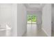 Light-filled hallway with access to backyard at 25109 Macapa Dr, Punta Gorda, FL 33983