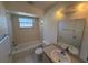 Bathroom with a bathtub, toilet and vanity at 2599 Woodgate Ln # K7, Sarasota, FL 34231