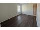 Bright bedroom with wood-look flooring and closet at 2599 Woodgate Ln # K7, Sarasota, FL 34231