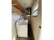 Laundry room with washer, dryer and shelving at 2599 Woodgate Ln # K7, Sarasota, FL 34231