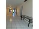 Bright living room with tile floor and access to balcony at 2599 Woodgate Ln # K7, Sarasota, FL 34231