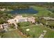 Aerial view of country club, golf course, and lake at 32 Bayhead Ln, Osprey, FL 34229