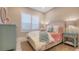 Bright bedroom with queen bed, window with shutters, and teal dresser at 32 Bayhead Ln, Osprey, FL 34229