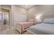 Spacious bedroom with twin beds and closet with sliding doors at 32 Bayhead Ln, Osprey, FL 34229