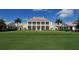 Elegant clubhouse overlooking a green lawn at 32 Bayhead Ln, Osprey, FL 34229