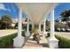 Grand clubhouse entrance with columns and golf carts at 32 Bayhead Ln, Osprey, FL 34229