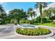 Gated entrance to community with fountain and landscaping at 32 Bayhead Ln, Osprey, FL 34229