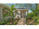 Relaxing front porch with seating and landscaping at 32 Bayhead Ln, Osprey, FL 34229