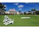 Relaxing view of a golf course with white chairs at 32 Bayhead Ln, Osprey, FL 34229