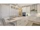 Bright white kitchen with large island and ample storage at 32 Bayhead Ln, Osprey, FL 34229