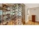 Wine cellar with glass enclosure and restaurant view at 32 Bayhead Ln, Osprey, FL 34229