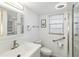 Updated bathroom with white vanity, walk-in shower, and modern fixtures at 320 Whitfield Ave, Sarasota, FL 34243