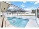 Screened-in pool area with ample space for relaxation and entertainment at 320 Whitfield Ave, Sarasota, FL 34243