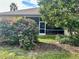 Private backyard with lush landscaping and screened patio at 3312 92Nd E Ave, Parrish, FL 34219