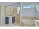 Bathroom with shower, soaking tub, and window at 3312 92Nd E Ave, Parrish, FL 34219