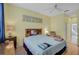 Bright bedroom with ceiling fan and en suite bathroom at 3312 92Nd E Ave, Parrish, FL 34219